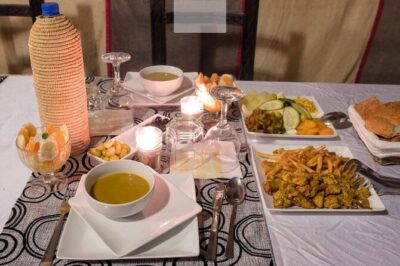 Camel trek with 1 Night in Luxury camp with Dinner+ Sundbording - Dinner under the stars: ensuite tent plus drummers by the campfire