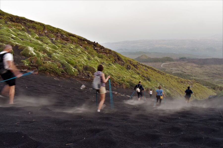 Catania: Etna Morning or Sunset Trek with Lava Tunnel & Gear - The hike on Etna: craters, lava deserts, and a steady pace
