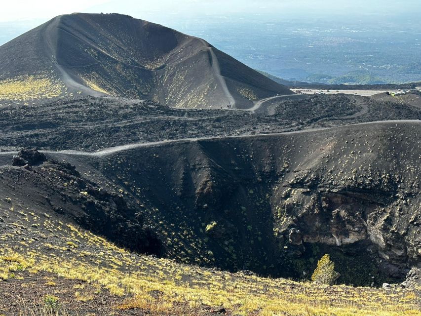 Catania: Etna Morning or Sunset Trek with Lava Tunnel & Gear - The 2001 eruptive theater stop: where the story gets specific