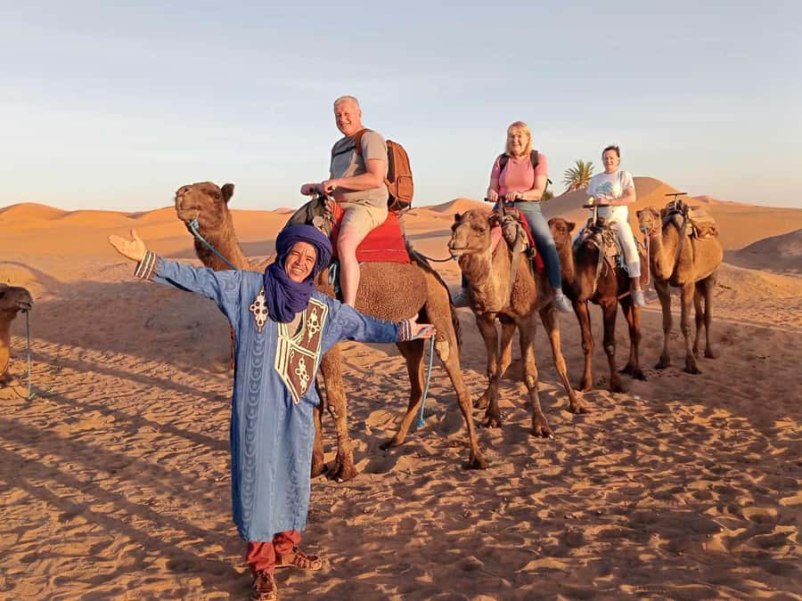 From Merzouga: Overnight Camel Trek over Erg Chebbi Dunes - Day 1 in Erg Chebbi: Sunset Camel Ride, Sandboarding, and Tagine