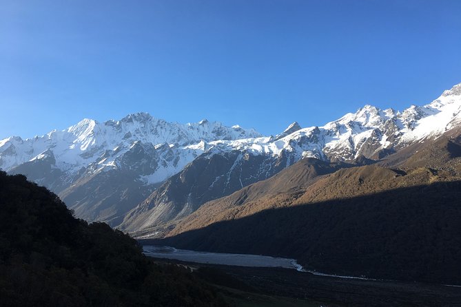 Langtang Kyanjin Gompa Trek - 11 Days - Tsergo Ri from Kyanjin Gompa: steep switchbacks, prayer flags, and mountain panorama