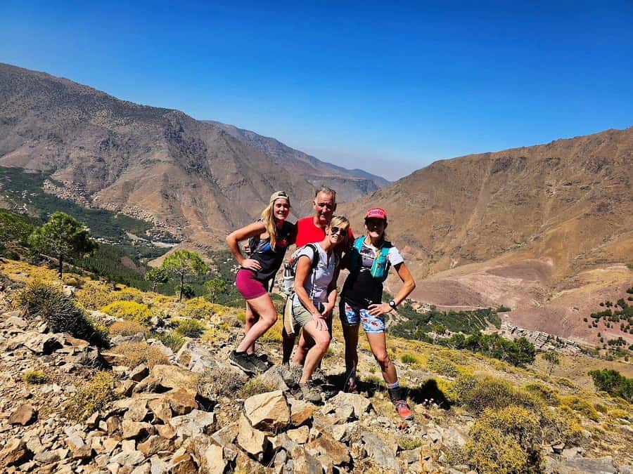 Marrakech: High Atlas Tedali Summit Guided Day Trek - Guided hiking in the Atlas: pace, guide, and Berber village scenes
