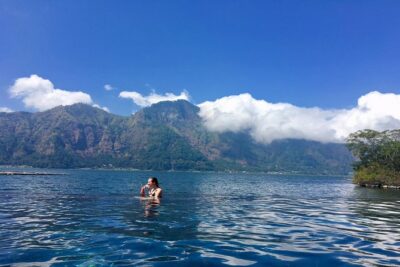 Mount Batur Sunrise Trekking & Hot Spring Tour - The trek up Batur: flashlight start, walking sticks, and guided pacing