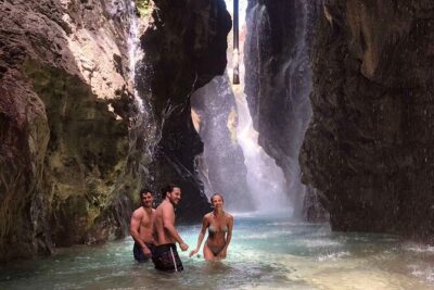 River Trekking at Kourtaliotiko Gorge Waterfalls to Preveli Beach - Stop 1: Kourtaliotiko Gorge waterfall swim and cliff steps